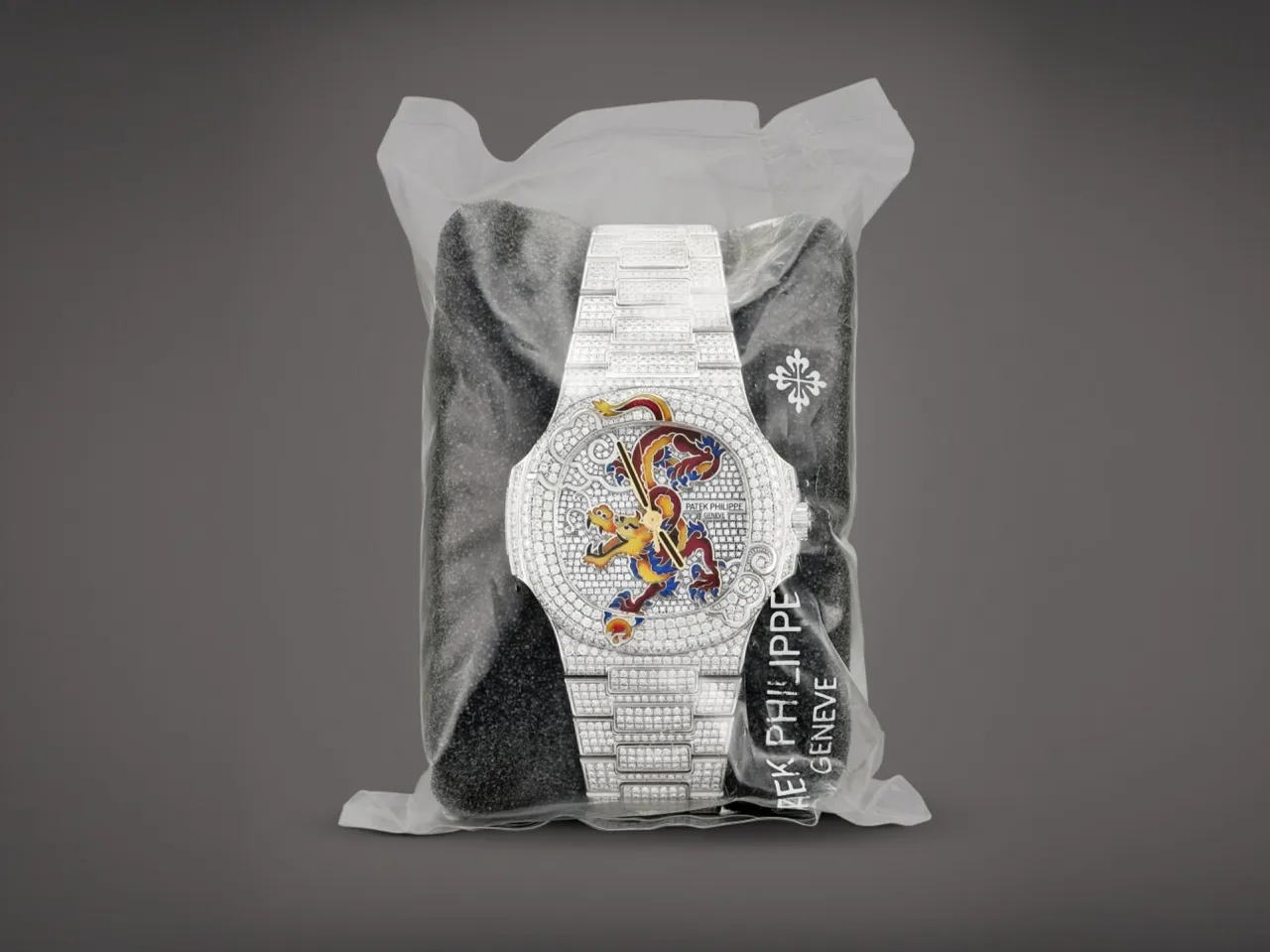 Patek Philippe Nautilus Reference 5720 White Gold, Diamond, and Enamel Circa 2012, 5,715,000 HKD